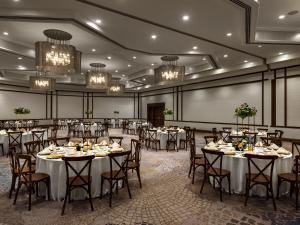 a banquet hall with tables and chairs and chandeliers at The Westin San Diego Bayview in San Diego