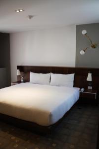 Postel nebo postele na pokoji v ubytování Flor de Mayo Boutique Hotel, Spa & Restaurant