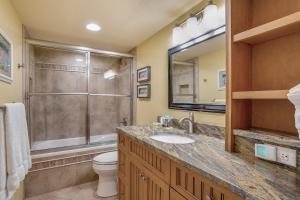 a bathroom with a toilet and a sink and a shower at Sanibel Sunsets in Fort Myers +17 photos