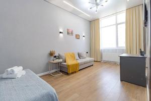 Ένα ή περισσότερα κρεβάτια σε δωμάτιο στο Apartment near Astana Arena, EXPO 2017