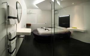 Postel nebo postele na pokoji v ubytování Absoluto Design Hotel