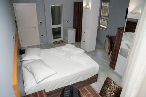 Postel nebo postele na pokoji v ubytování Hotel Pernoca