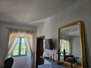 a room with a mirror and a desk with a mirror at A Casa Di a Vita in Rapale