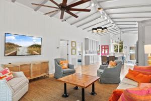 a living room with a couch and a table at It is a Happy Day at the Beach in Pawleys Island