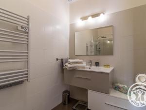 a white bathroom with a sink and a mirror at Séjour de charme avec piscine à Saint-Georges-sur-Layon, proche de Saumur et des châteaux de la Loire - FR-1-622-81 in Méa +17 photos