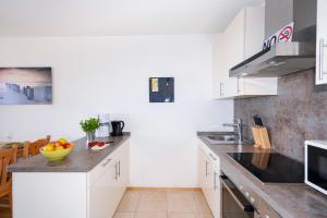 Kuchyň nebo kuchyňský kout v ubytování D5-667 Meerblick, strandnah
