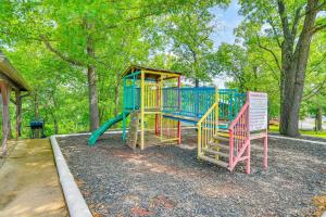 a playground with a slide in a park at Hike and Leaf Peep! Condo 2 Mi to Silver Dollar City in Branson West