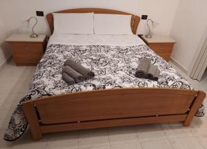 a bedroom with a bed with two pillows on it at La Foggia seaside paradise in Siculiana