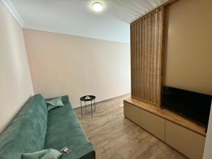 TV a/nebo společenská místnost v ubytování Green House in Tskaltubo