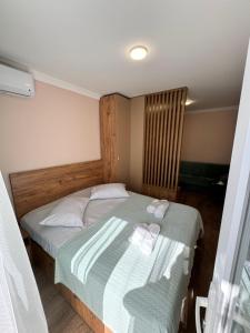 Postel nebo postele na pokoji v ubytování Green House in Tskaltubo