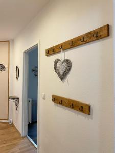 a heart hanging on a wall in a room at Wohlfühloase in der City in Luckenwalde