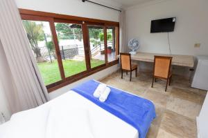 Postel nebo postele na pokoji v ubytování Wafeh Pampulha Suítes