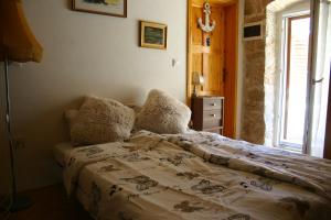 Posteľ alebo postele v izbe v ubytovaní Studio Apartment La Maison de Catherine