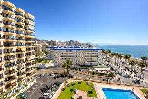 an aerial view of a city and the ocean at Benalmádena Living in Benalmádena