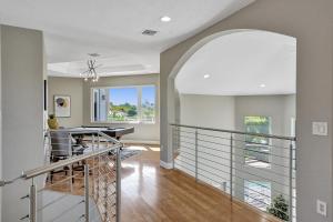 a staircase in a home with an archway at Luxury 8-BR with Pool Basketball Volleyball in Plantation