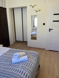 Posteľ alebo postele v izbe v ubytovaní Karwia Pokoje & Apartamenty