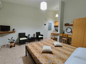 a bedroom with a bed with two pillows on it at My Lemnos Studios - Studio 2 in Repanídhion