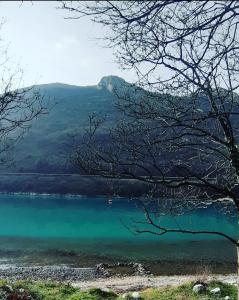 a view of a lake with a mountain in the background at PLOMIN SKY&BAY in Plomin