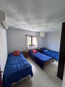 En eller flere senge i et værelse på Casa YO