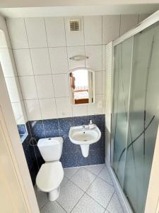 Kúpeľňa v ubytovaní Domino Dom Gościnny