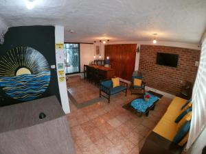 an aerial view of a living room with a couch at Hotel Estación del Sol in Las Núñez
