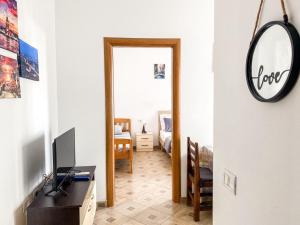 a hallway with a room with a mirror and a desk at LunaSol seaside Apartments in Durrës