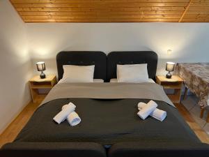 a bedroom with a large bed with three pillows at Lucky Villa in Hévíz +54 photos
