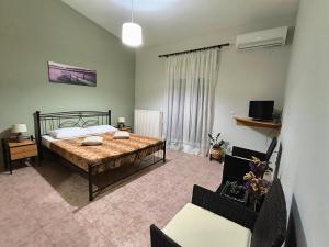 A bed or beds in a room at My Lemnos Studios - Studio 4