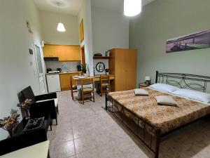 A bed or beds in a room at My Lemnos Studios - Studio 4