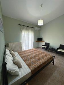 A bed or beds in a room at My Lemnos Studios - Studio 4