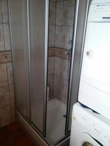 a shower with a glass door in a bathroom at Bella Vista in La Mata