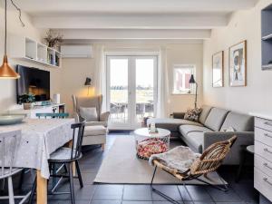 a living room with a couch and a table at 6 person holiday home in Hadsund-By Traum in Hadsund