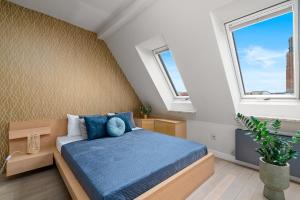 Кровать или кровати в номере A.S. Home Apartamenty Rynek 50 R510
