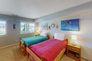 two beds in a room with two windows at Lake Daze at Wapato Point in Manson +31 photos