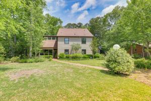 a home with a yard with a house at Morehead City Home about Walk to Beach Park! in Morehead City