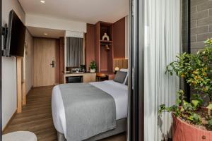 Postel nebo postele na pokoji v ubytování Heiss Hotel + 37 fotografií