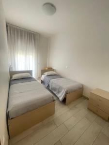 A bed or beds in a room at Palazzina del sole