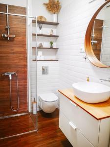 a bathroom with a sink and a shower at The Golden View Apartment in Split +24 photos