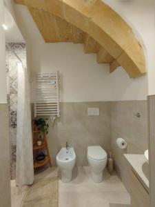 a bathroom with a toilet and a sink at Dimora delle rose in Lecce +30 photos