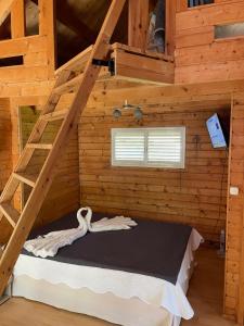 Postel nebo postele na pokoji v ubytování LE CHALET DE LA POINTE + 5 fotografií