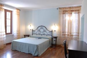 Ένα ή περισσότερα κρεβάτια σε δωμάτιο στο Agriturismo Al Palazzo