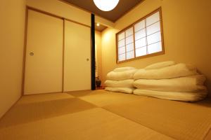 a room with a bunch of white towels at Saifu House - Vacation STAY 29910v in Dazaifu