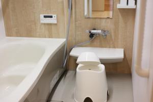 a bathroom with a white toilet and a sink at Saifu House - Vacation STAY 29910v in Dazaifu