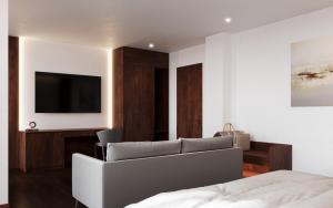 TV a/nebo společenská místnost v ubytování Richico Apartments And Hotel