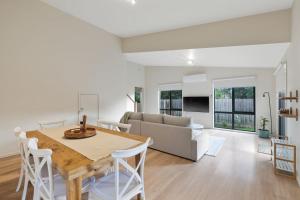 a living room with a table and a couch at Tahiti Cape Woolamai in Cape Woolamai