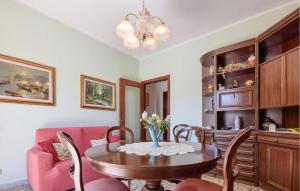 a dining room with a table and chairs and a couch at Gorgeous Apartment In Sestri Levante in Sestri Levante +13 photos