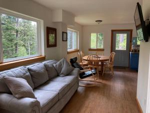 a living room with a couch and a table at Beach Roadhouse in Haines