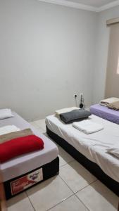 Ένα ή περισσότερα κρεβάτια σε δωμάτιο στο Hospedagem Vermont