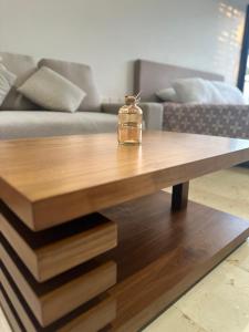a glass jar sitting on top of a wooden coffee table at Smart Home luxury Condo in Playa del Carmen