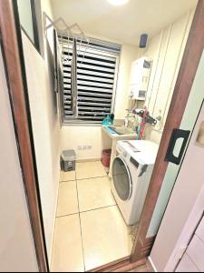 a small bathroom with a washing machine and a sink at Santa Cruz de La Sierra - 3 Pago con Qr bedroom luxury apartment in Santa Cruz de la Sierra +21 photos
